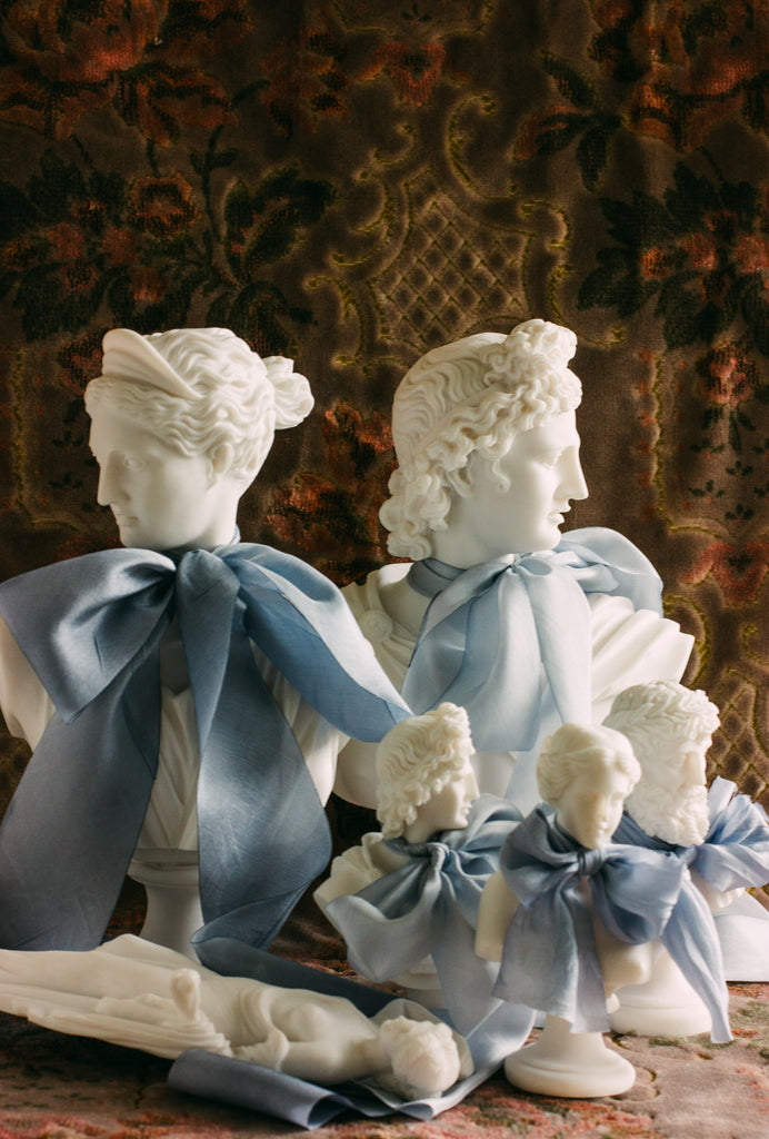 Soft French blue silk ribbon draped elegantly, ideal for tying wedding bouquets, bridal favors, and invitations