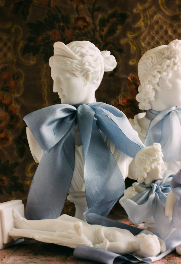 Delicate French blue silk ribbon displayed on a flat surface, perfect for wedding stationery, bouquet accents, and table styling