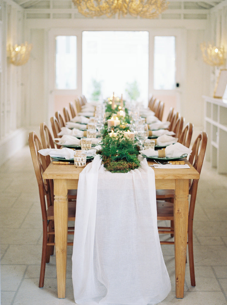 White gauzy table runners for wedding decor and events