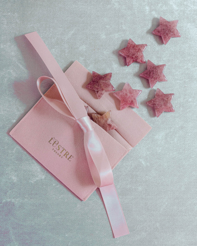 Strawberry quartz stars with gift pouch in translucent red-pink shades, beautifully arranged for crystal lovers and collectors