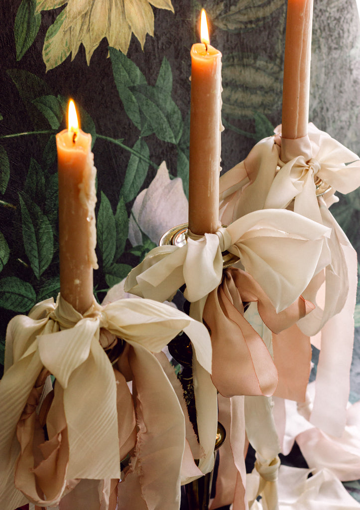 Luxury hand dyed white silk ribbon loosely bowed, used for wedding bouquet stems, invitation design, and romantic décor