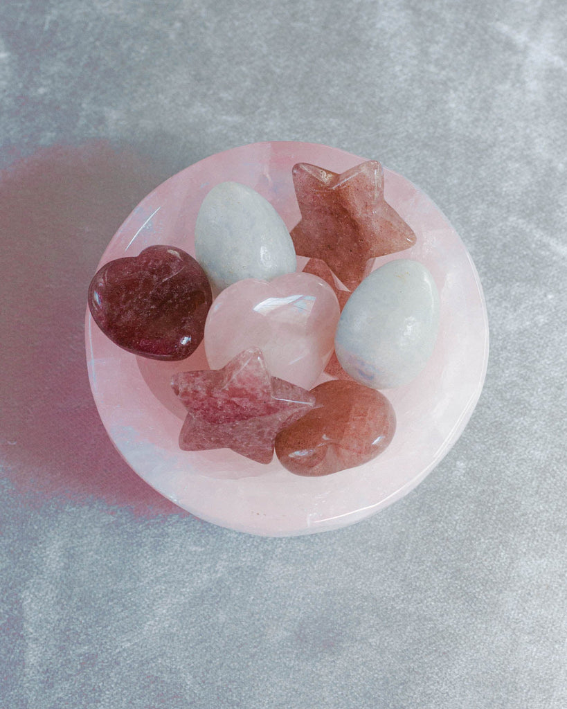 Pink rose quartz ctrystal bowl with heart and star-shaped crystals for curated healing crystal gift