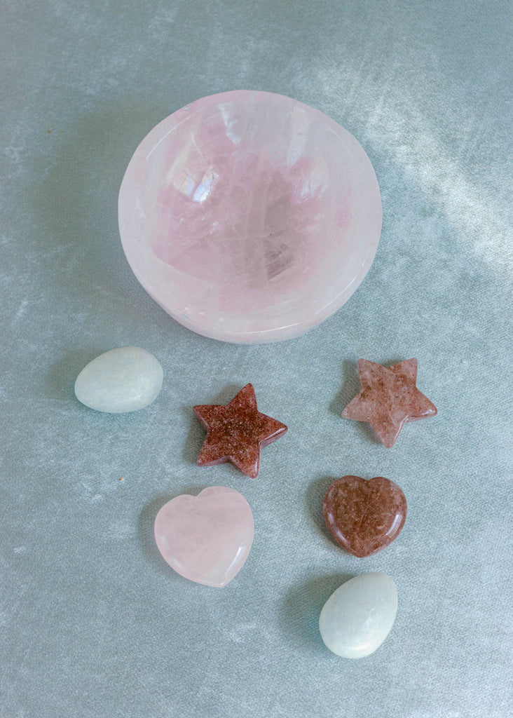 Collection of pink and red gem stones for healing crystal gift set with rose quartz and strawberry quartz crystal stones