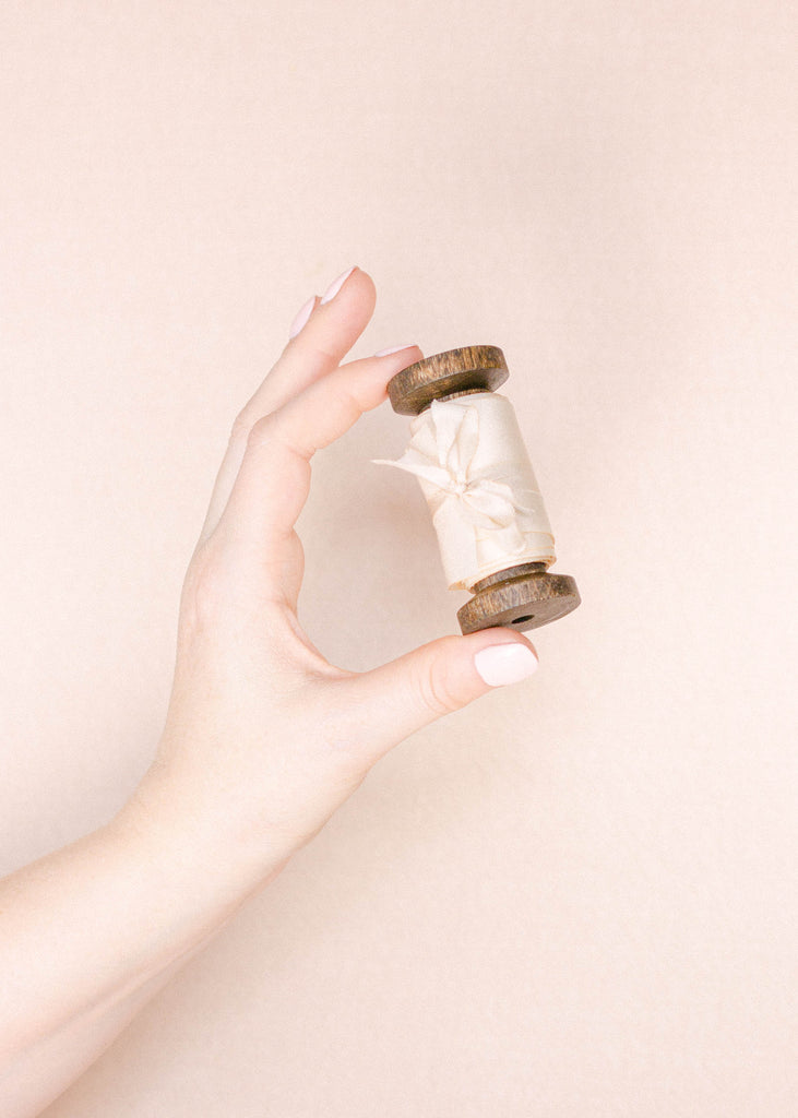 Soft white hand dyed silk ribbon for wedding stationery, bridal shower favors, and elegant bouquet styling