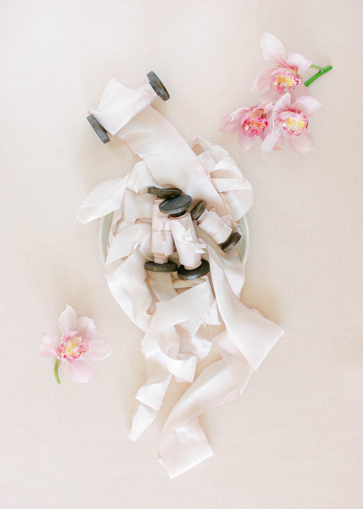 Luxury blush pink silk ribbon for tying around wedding favors, gift wrapping, and wedding crafts